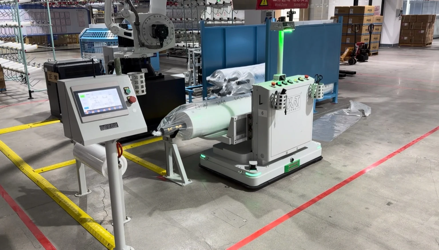 AGV, weighing station and robotic roll handling