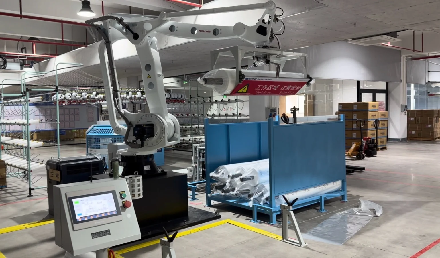 AGV, weighing station and robotic roll handling