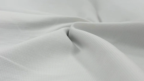 Stretch Double-Knit Eyelet Fabric folded fabric cover thumbnail