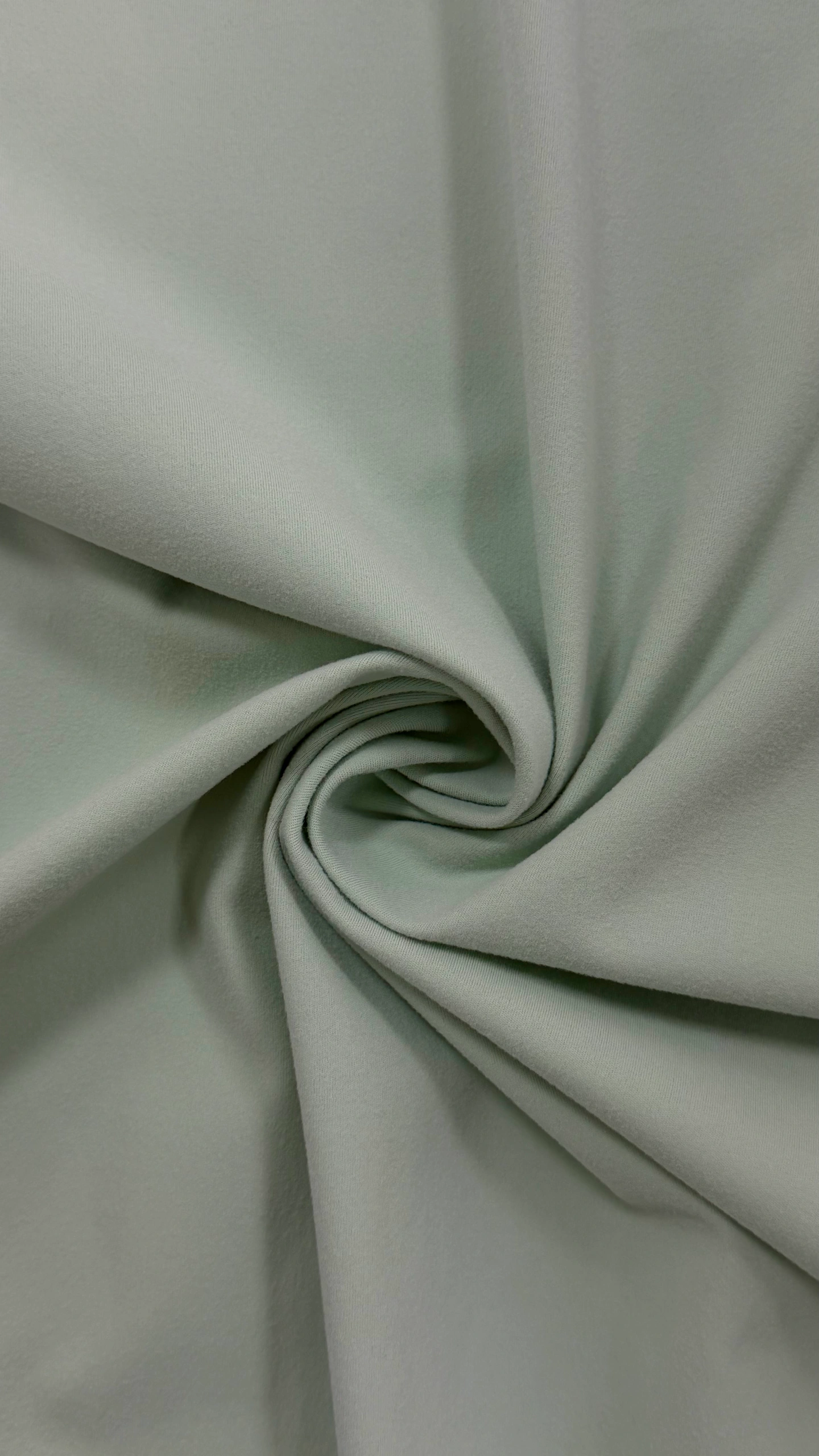 Rolled knitted fabric showing a soft surface texture